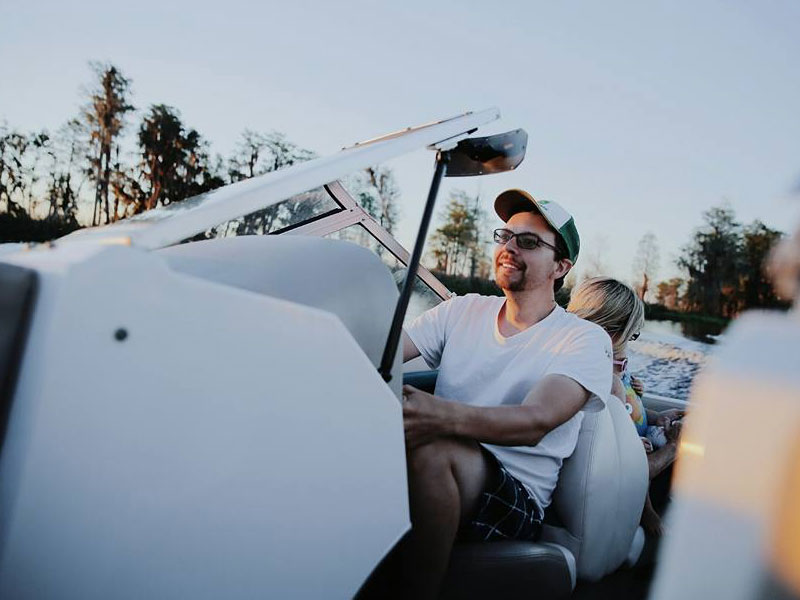 Ben Homan Driving Boat With Family