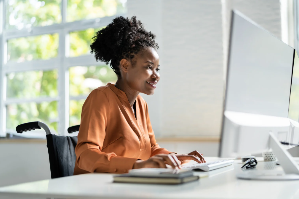 a woman using her computer to check her website performance